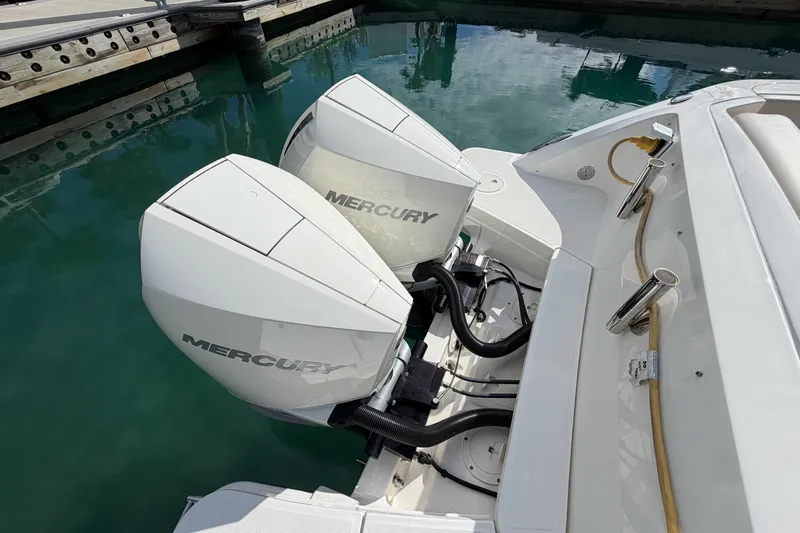  Yacht Photos Pics 2022 Boston Whaler 320 Vantage with dual Mercury outboard engines docked.