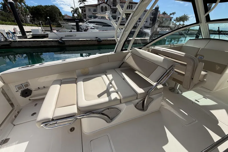  Yacht Photos Pics 2022 Boston Whaler 320 Vantage interior with luxurious seating at marina.