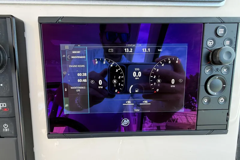  Yacht Photos Pics 2022 Boston Whaler 320 Vantage dashboard display showing engine hours and maintenance details.