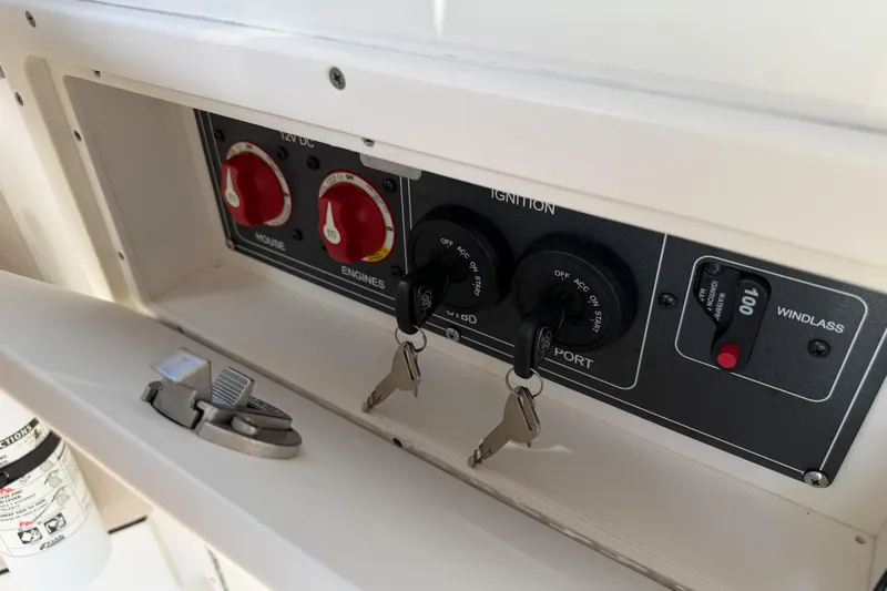  Yacht Photos Pics Control panel of a 2022 Boston Whaler 320 Vantage boat with ignition keys.