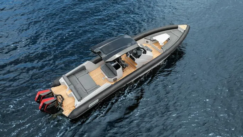  Yacht Photos Pics 2025 Skipper 38 NC boat on water, featuring sleek design and dual outboard engines.