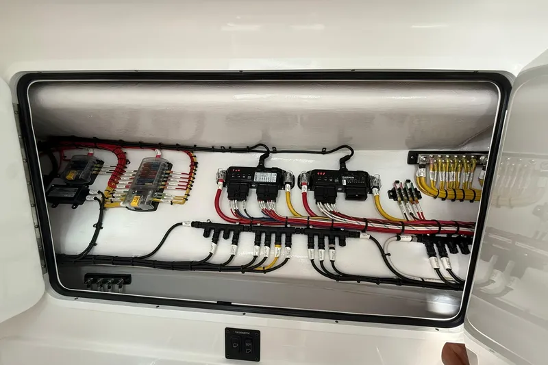  Yacht Photos Pics Electrical panel of 2026 Mag Bay 43 CC boat, showcasing organized wiring and components.