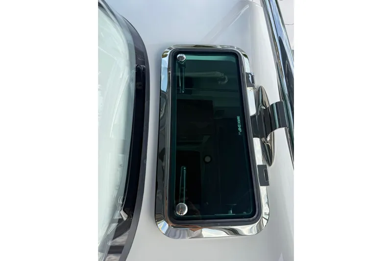  Yacht Photos Pics 2026 Mag Bay 43 CC boat window with sleek chrome trim and modern design.