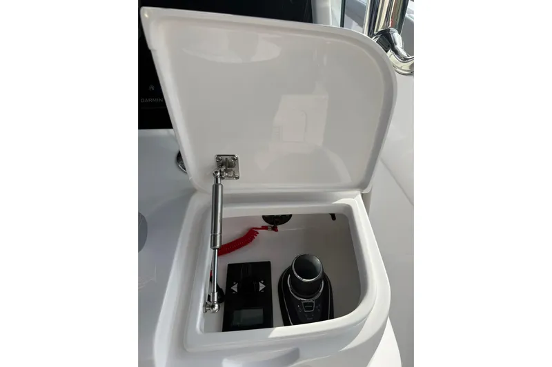  Yacht Photos Pics Open compartment on 2026 Mag Bay 43 CC boat, showing control panel and joystick.