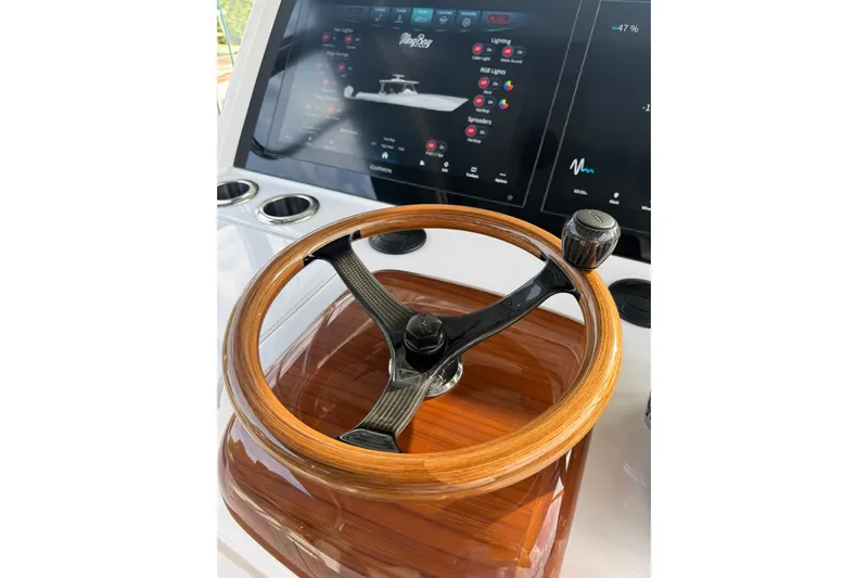  Yacht Photos Pics Steering wheel of 2026 Mag Bay 43 CC boat with advanced control panel.