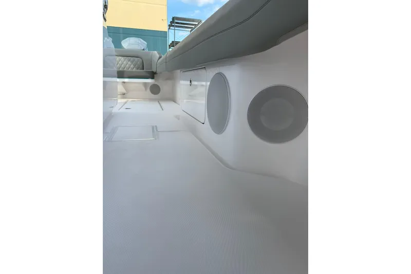  Yacht Photos Pics Interior view of 2026 Mag Bay 43 CC boat, featuring sleek seating and built-in speakers.