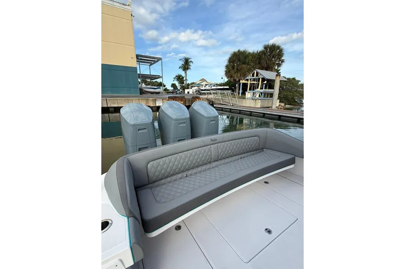  Yacht Photos Pics 2026 Mag Bay 43 CC boat with luxurious seating and triple outboard engines.