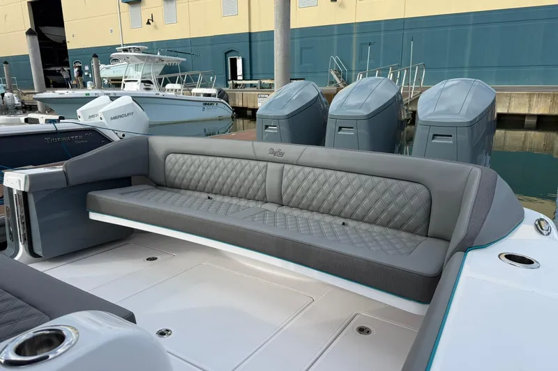  Yacht Photos Pics Luxurious seating on 2026 Mag Bay 43 CC boat, docked with powerful Mercury engines.