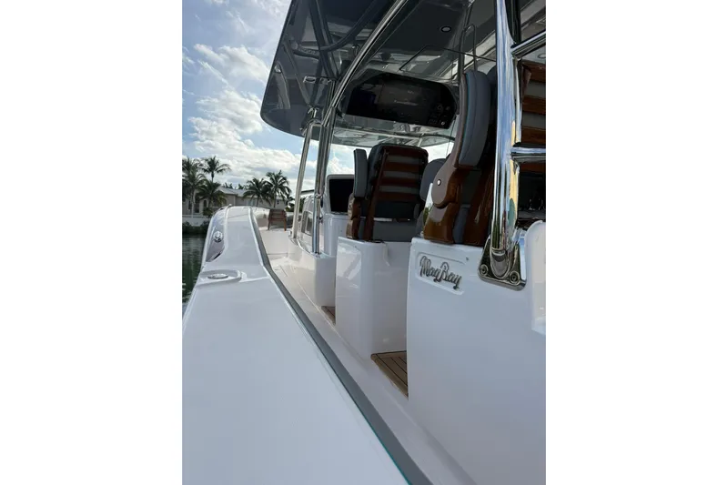  Yacht Photos Pics 2026 Mag Bay 43 CC boat with sleek design and luxurious seating under a clear sky.