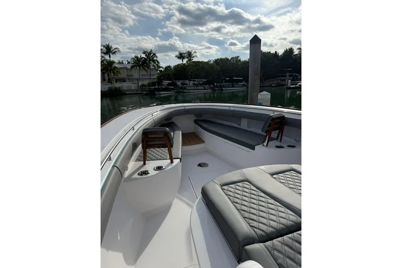  Yacht Photos Pics 2026 Mag Bay 43 CC boat interior with luxurious seating and scenic marina view.