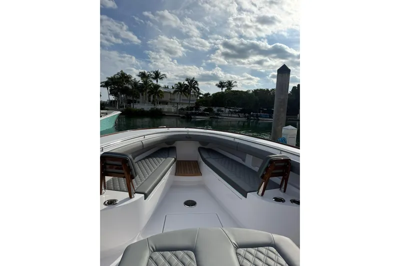  Yacht Photos Pics 2026 Mag Bay 43 CC boat interior with luxurious seating and scenic marina view.