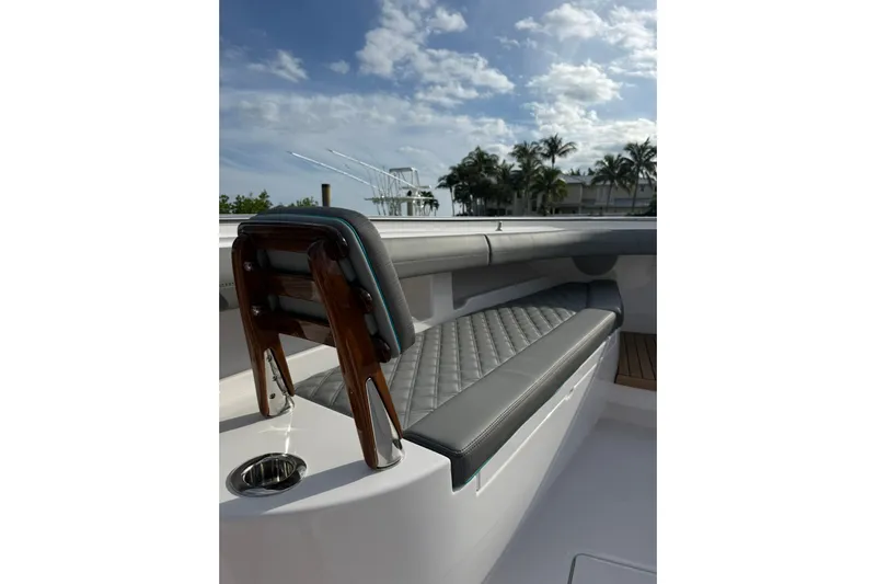  Yacht Photos Pics Luxurious seating on 2026 Mag Bay 43 CC boat with elegant design and palm trees in background.