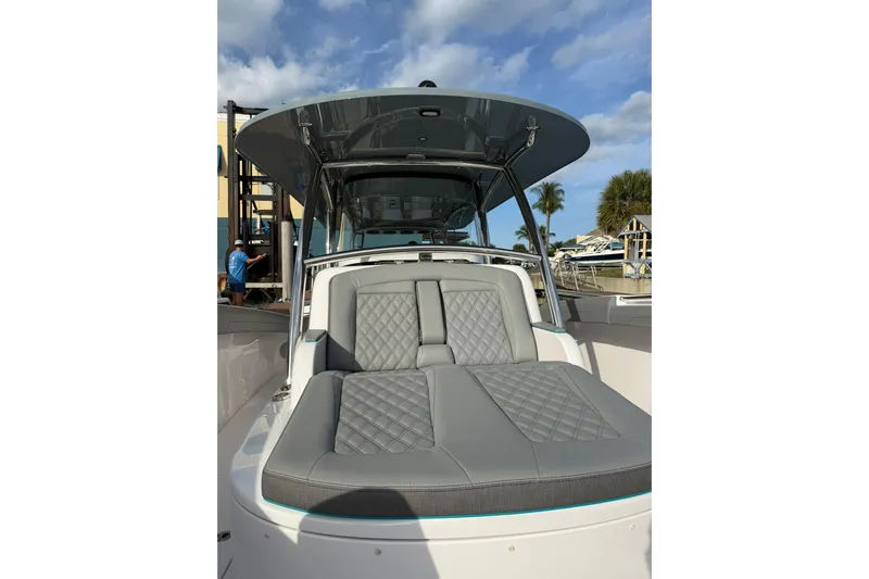  Yacht Photos Pics 2026 Mag Bay 43 CC boat with luxurious gray seating under a clear blue sky.