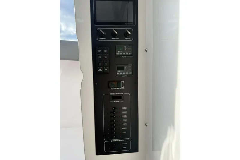 Yacht Photos Pics Control panel of 2026 Mag Bay 43 CC boat with switches and displays.