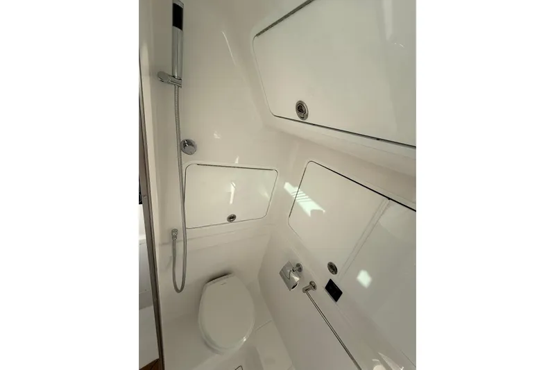  Yacht Photos Pics 2026 Mag Bay 43 CC boat bathroom with modern fixtures and sleek design.