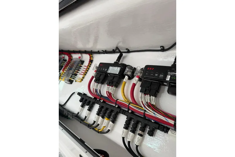  Yacht Photos Pics Electrical wiring system in 2026 Mag Bay 43 CC boat, showcasing organized cables and connectors.
