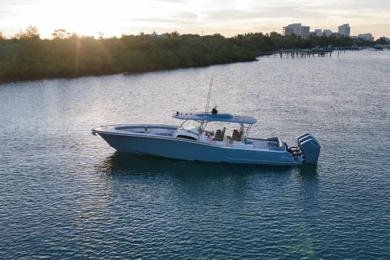  Yacht Photos Pics 2026 Mag Bay 43 CC boat on calm water at sunset.
