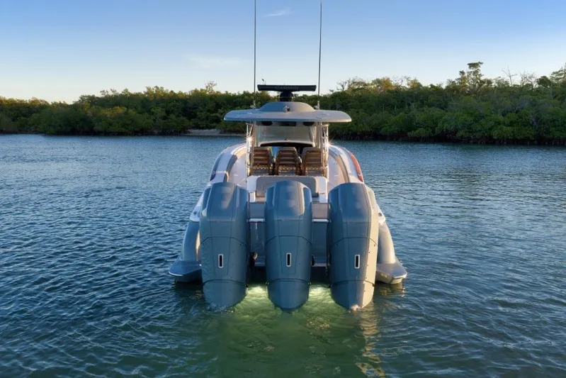  Yacht Photos Pics 2026 Mag Bay 43 CC boat with triple outboard engines on calm water.