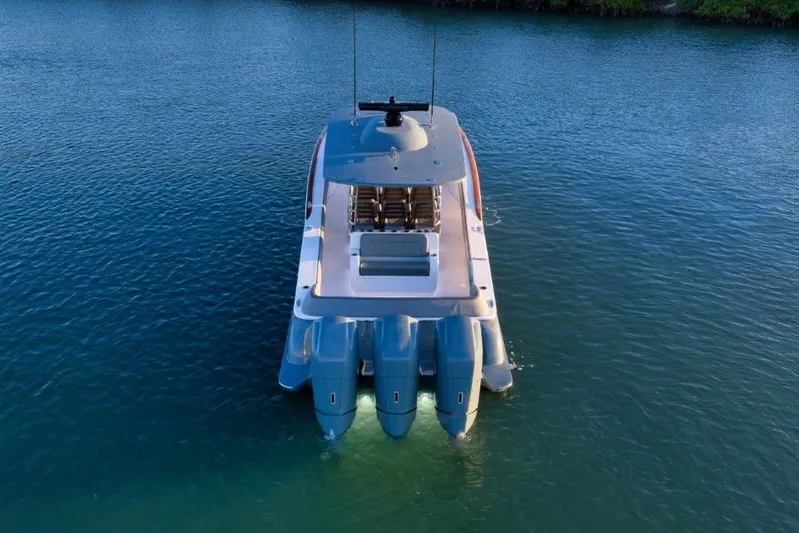  Yacht Photos Pics 2026 Mag Bay 43 CC boat with triple outboard engines on calm water.