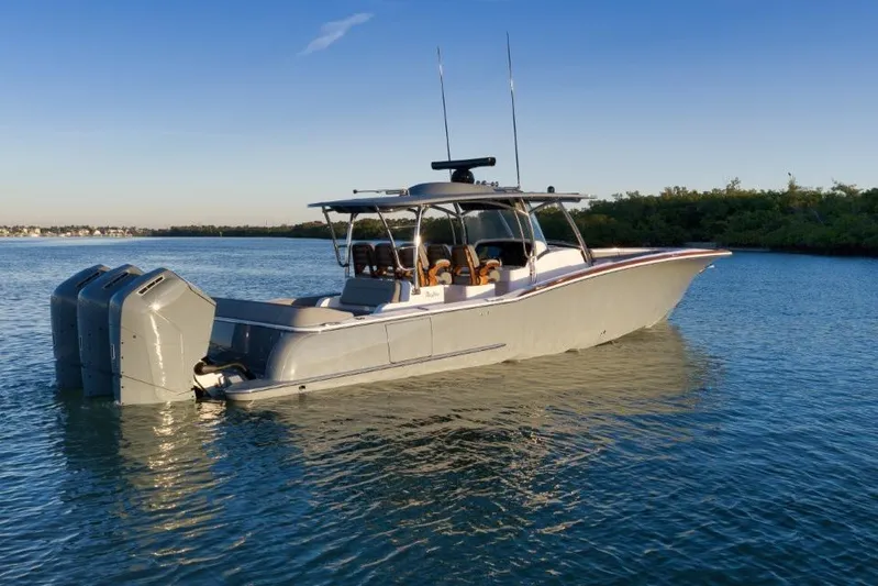  Yacht Photos Pics 2026 Mag Bay 43 CC boat on calm water, featuring triple outboard engines.