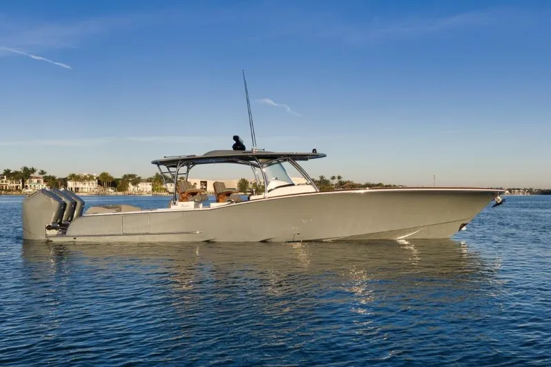  Yacht Photos Pics 2026 Mag Bay 43 CC boat on calm water under clear blue sky.