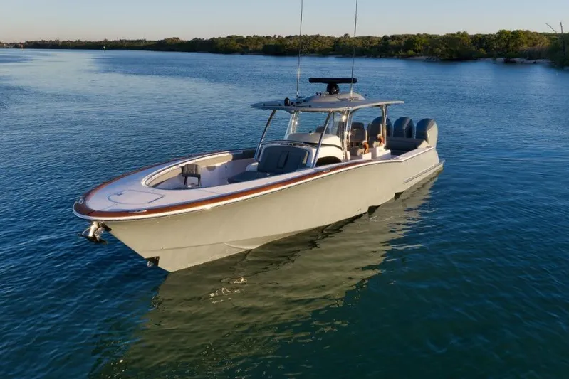  Yacht Photos Pics 2026 Mag Bay 43 CC boat on calm water, sleek design, sunny day.