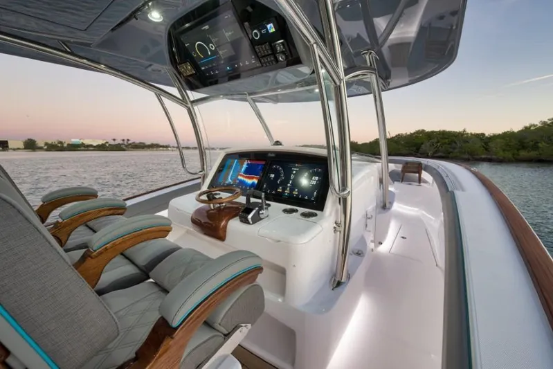  Yacht Photos Pics 2026 Mag Bay 43 CC boat cockpit with advanced navigation displays at sunset.