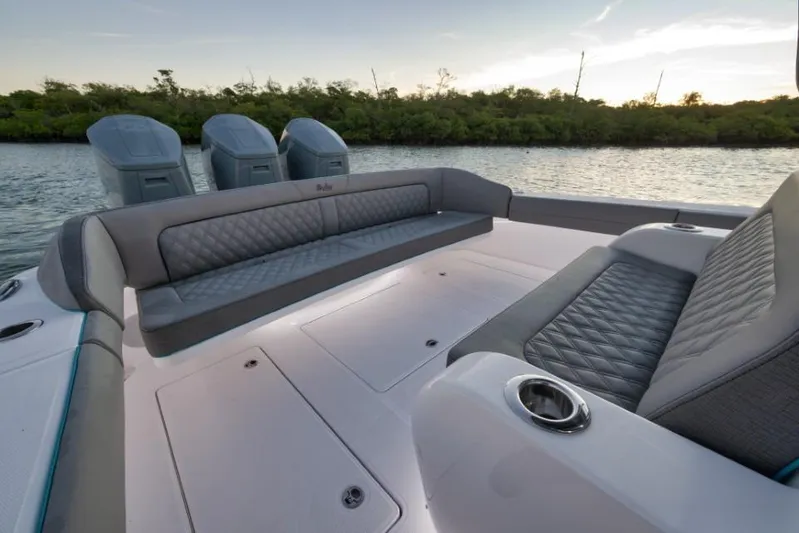  Yacht Photos Pics 2026 Mag Bay 43 CC boat interior with luxurious seating and multiple outboard engines.