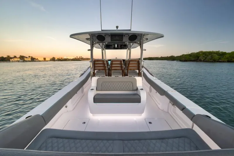  Yacht Photos Pics 2026 Mag Bay 43 CC boat interior on calm water at sunset.