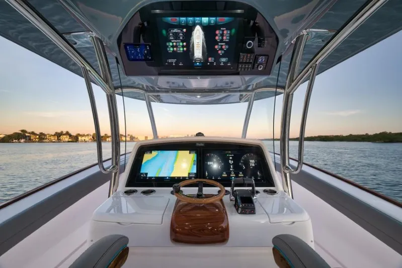  Yacht Photos Pics Interior view of 2026 Mag Bay 43 CC boat cockpit with advanced navigation displays.