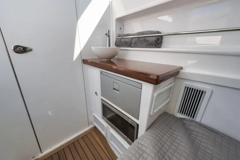  Yacht Photos Pics Interior of 2026 Mag Bay 43 CC boat with modern amenities and wooden accents.