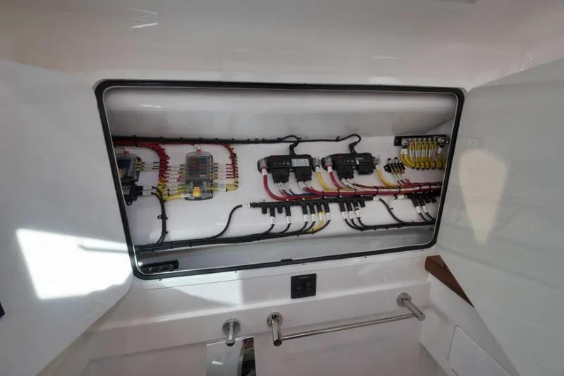  Yacht Photos Pics Electrical panel inside 2026 Mag Bay 43 CC boat, showcasing wiring and components.
