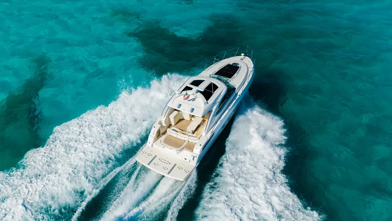 T Yacht Photos Pics 2013 Sea Ray 470 Sundancer cruising on clear turquoise waters.