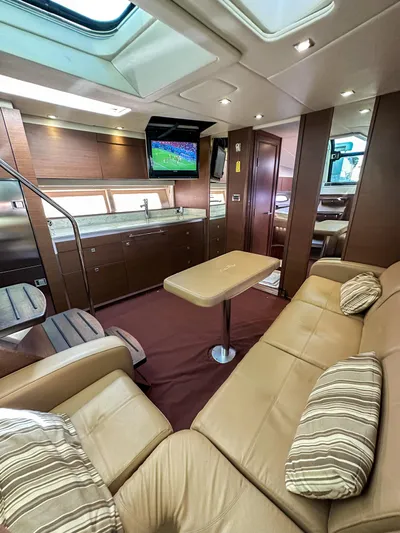T Yacht Photos Pics Luxurious interior of 2013 Sea Ray 470 Sundancer yacht with plush seating and modern amenities.