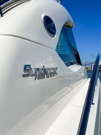 T Yacht Photos Pics 2013 Sea Ray 470 Sundancer yacht, sleek design, sunny day, close-up view.