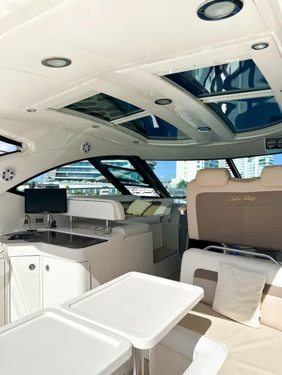 T Yacht Photos Pics Luxurious interior of 2013 Sea Ray 470 Sundancer yacht with modern amenities and seating.