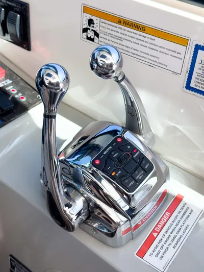 T Yacht Photos Pics Close-up of 2013 Sea Ray 470 Sundancer throttle controls with warning labels.