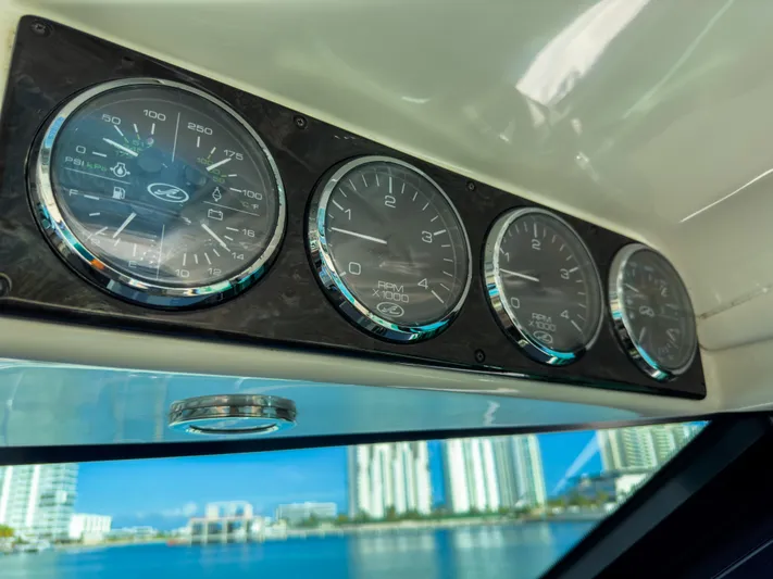 T Yacht Photos Pics Dashboard gauges of 2013 Sea Ray 470 Sundancer yacht with cityscape view.