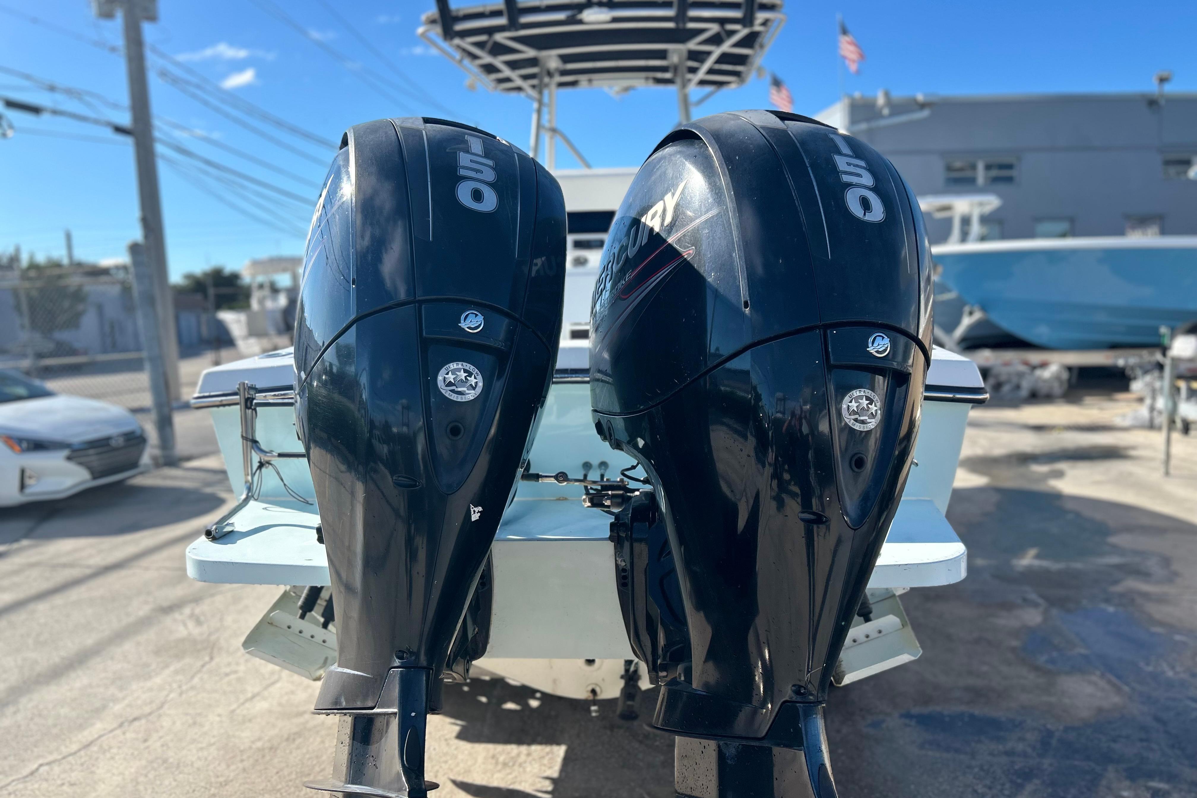 Twin Mercury 150 outboard engines on a 1991 Contender 25 Open boat.