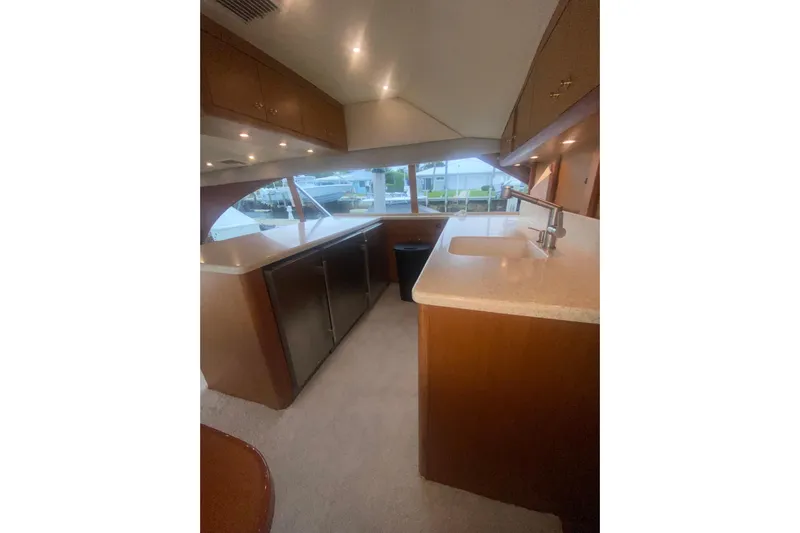  Yacht Photos Pics Interior of 2002 Ocean Yacht Super Sport with modern kitchen and sleek design.
