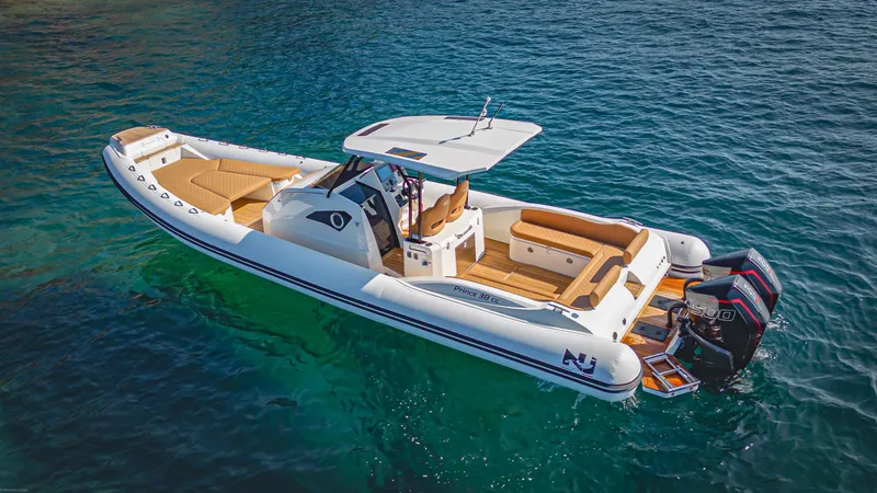 Stock Inventory Yacht Photos Pics 2024 Nuova Jolly Prince 38 boat on clear blue water, featuring sleek design and twin engines.