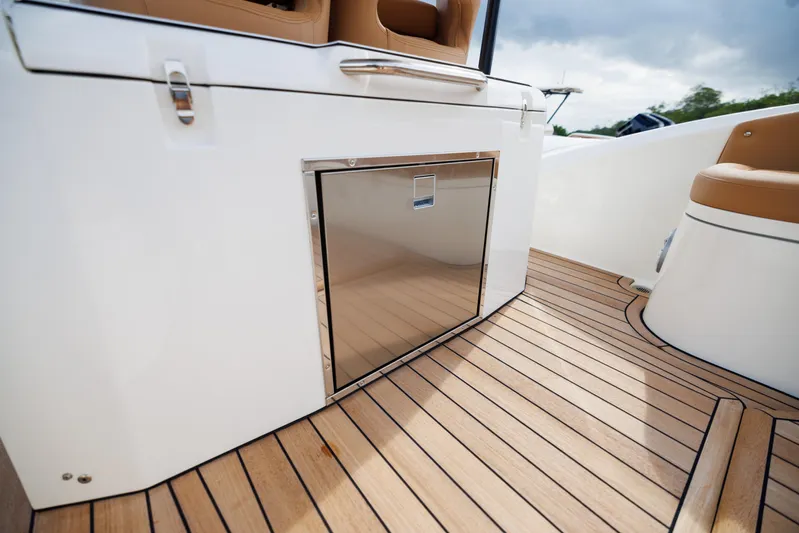 Stock Inventory Yacht Photos Pics 2024 Nuova Jolly Prince 38 boat interior with sleek wood flooring and modern cabinetry.