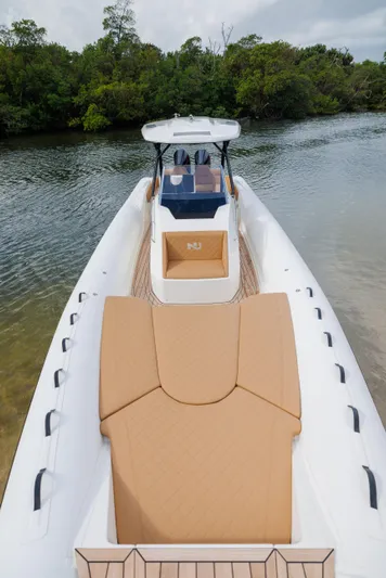 Stock Inventory Yacht Photos Pics 2024 Nuova Jolly Prince 38 boat on calm water, featuring sleek design and spacious deck.