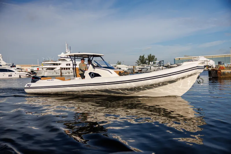 Stock Inventory Yacht Photos Pics 2024 Nuova Jolly Prince 38 boat on calm water, docked at a marina.
