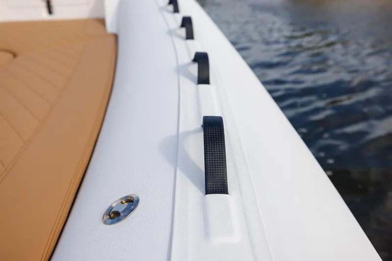 Stock Inventory Yacht Photos Pics 2024 Nuova Jolly Prince 38 boat detail with white and tan design on water.