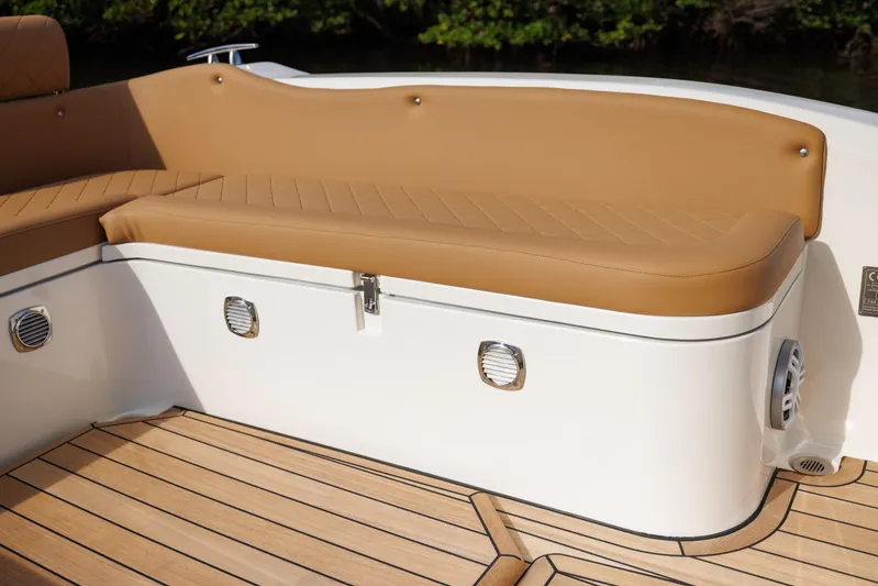 Stock Inventory Yacht Photos Pics Luxurious seating on 2024 Nuova Jolly Prince 38 boat with tan cushions and teak flooring.