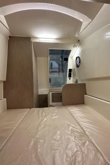 Stock Inventory Yacht Photos Pics Interior cabin of 2024 Nuova Jolly Prince 38 boat, featuring modern design and wood accents.