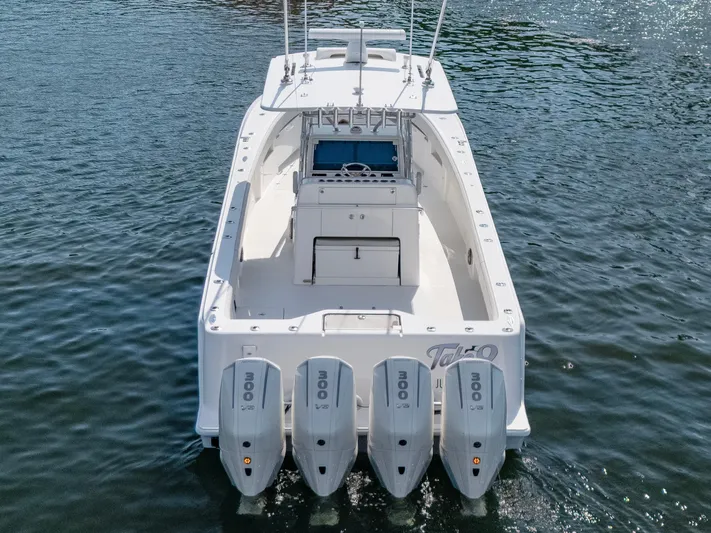  Yacht Photos Pics 2024 SeaVee 390B boat with four powerful outboard engines on the water.