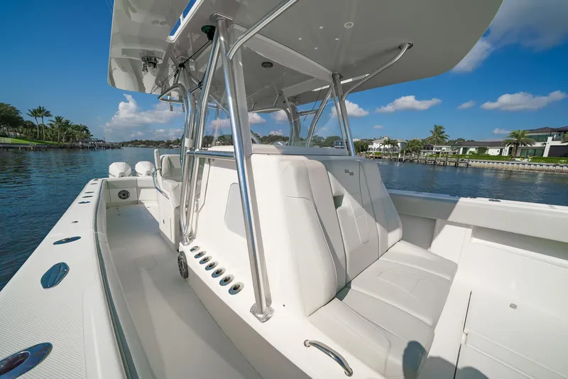  Yacht Photos Pics 2024 SeaVee 390B boat with sleek design, spacious seating, and modern features on a sunny day.