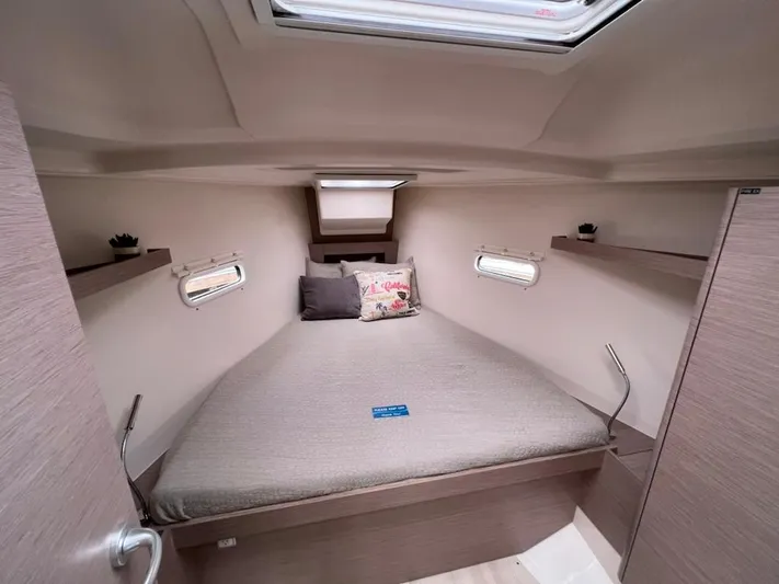 Mdr 388 #305 In Stock Yacht Photos Pics Interior cabin of 2023 Hanse 388 sailboat with cozy bed and skylight.